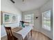 Cozy dining area featuring a table set for two and large, bright windows at 86 Blackberry Creek Dr, St Cloud, FL 34769