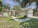 Well-maintained home featuring lush landscaping, a two-car garage, and a classic suburban appeal at 86 Blackberry Creek Dr, St Cloud, FL 34769