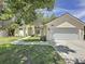 Well-maintained home featuring lush landscaping, a two-car garage, and a classic suburban appeal at 86 Blackberry Creek Dr, St Cloud, FL 34769
