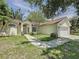 Well-maintained home featuring lush landscaping, a two-car garage, and a classic suburban appeal at 86 Blackberry Creek Dr, St Cloud, FL 34769