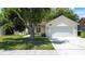 Inviting single-Gathering home with a two-car garage, a well-kept lawn, and mature landscaping at 86 Blackberry Creek Dr, St Cloud, FL 34769