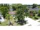 Picturesque home with a mature tree in the yard, well-kept lawn, and lush greenery, offering curb appeal at 86 Blackberry Creek Dr, St Cloud, FL 34769