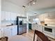 Well-equipped kitchen with stainless steel appliances, ample counter space, and bright, white cabinets at 86 Blackberry Creek Dr, St Cloud, FL 34769