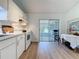 Bright kitchen with seamless access to the screened in patio through sliding glass doors at 86 Blackberry Creek Dr, St Cloud, FL 34769
