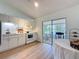 Charming kitchen offering a delightful view of the lanai, perfect for enjoying a tranquil indoor-outdoor experience at 86 Blackberry Creek Dr, St Cloud, FL 34769
