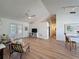 Open living space featuring wood floors, bright lighting and a dining area at 86 Blackberry Creek Dr, St Cloud, FL 34769