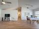 Open living space featuring wood floors, bright lighting and a dining area at 86 Blackberry Creek Dr, St Cloud, FL 34769