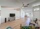 Open-concept living area that connects seamlessly to the dining area for flexible living at 86 Blackberry Creek Dr, St Cloud, FL 34769