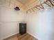 Walk-in closet featuring built-in wire shelving and a compact black safe at 86 Blackberry Creek Dr, St Cloud, FL 34769
