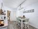 Charming dining area featuring a modern light fixture and a rustic farmhouse style at 9055 Treasure Trove Ln # 207, Kissimmee, FL 34747