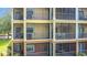 This is a view of multiple screened patios on the exterior of the condo at 9055 Treasure Trove Ln # 207, Kissimmee, FL 34747