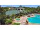A luxurious pool area with comfortable lounge chairs and a hot tub, perfect for relaxing and enjoying the outdoors at 9055 Treasure Trove Ln # 207, Kissimmee, FL 34747