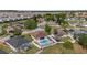 Aerial view of property showcasing fenced backyard with pool and proximity to neighborhood amenities at 906 Berwick Dr, Davenport, FL 33897