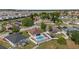 Aerial view of property showcasing fenced backyard with pool and proximity to neighborhood amenities at 906 Berwick Dr, Davenport, FL 33897