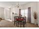 Dining Area with table, four chairs, and window providing natural light at 906 Berwick Dr, Davenport, FL 33897