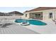 Backyard pool with deck and screened patio in the background at 906 Berwick Dr, Davenport, FL 33897