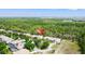 Aerial view of a charming neighborhood surrounded by lush greenery and a serene atmosphere at 9128 Stromboli Ct, Kissimmee, FL 34747