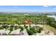 Aerial view of the property surrounded by a lush green landscape and neighborhood amenities at 9128 Stromboli Ct, Kissimmee, FL 34747