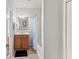 Bathroom with wooden cabinets, tile floor, and a shower/tub combination at 9128 Stromboli Ct, Kissimmee, FL 34747