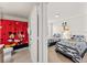View of themed bathroom and bedroom, featuring Mickey Mouse decor and twin beds at 9128 Stromboli Ct, Kissimmee, FL 34747