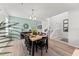 Dining room with stairs to the second floor, neutral colors, and modern decor at 9128 Stromboli Ct, Kissimmee, FL 34747