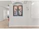 Hallway nook with decorative artwork and nearby bedroom entrances at 9128 Stromboli Ct, Kissimmee, FL 34747