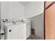 Bright laundry area features a full-size white washer and dryer with ample space for sorting and storage at 9128 Stromboli Ct, Kissimmee, FL 34747