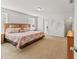 Spacious main bedroom with a king-size bed, neutral decor, and ample natural light at 9128 Stromboli Ct, Kissimmee, FL 34747