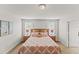Large main bedroom with two windows and a king-size bed with patterned bedding at 9128 Stromboli Ct, Kissimmee, FL 34747