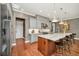 Modern kitchen with a spacious center island, stainless steel appliances, and sleek cabinetry at 10836 Royal Cypress Way, Orlando, FL 32836
