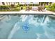 Backyard pool featuring a compass decoration and patio seating at 10836 Royal Cypress Way, Orlando, FL 32836