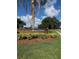 A welcoming brick community sign, surrounded by lush landscaping, creating an inviting entrance at 11922 Ottawa Ave, Orlando, FL 32837