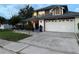 Charming two-story house with a spacious driveway and a well-manicured lawn at 11922 Ottawa Ave, Orlando, FL 32837