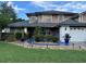 Well-maintained two-story home featuring a landscaped front yard and a two-car garage at 11922 Ottawa Ave, Orlando, FL 32837