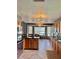 Spacious kitchen boasting stainless steel appliances, wooden cabinetry, and a breakfast nook perfect for Gathering meals at 11922 Ottawa Ave, Orlando, FL 32837