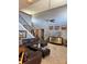 Open-concept living room with a staircase, tiled floors, and modern decor at 11922 Ottawa Ave, Orlando, FL 32837