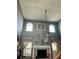 Bright living room featuring high ceilings, a fireplace, and abundant natural light at 11922 Ottawa Ave, Orlando, FL 32837