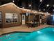 Backyard with a stunning pool, outdoor dining, patio and well-manicured landscaping at 11922 Ottawa Ave, Orlando, FL 32837