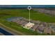 Aerial view of the property surrounded by water features, a pond, and lush landscape at 13809 Abberwick Dr, Orlando, FL 32832