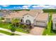 A high angle view of the home's architecture, landscaping, rooflines, and the neighborhood at 13809 Abberwick Dr, Orlando, FL 32832