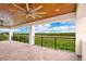This large balcony offers stunning views of the scenic landscape and has a beautiful wood ceiling at 13809 Abberwick Dr, Orlando, FL 32832