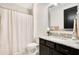 Bright bathroom with a vanity with granite countertop, a mirror, and a shower with curtain at 13809 Abberwick Dr, Orlando, FL 32832