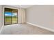 Bright bedroom featuring a sliding glass door with access to the lanai and an amazing view at 13809 Abberwick Dr, Orlando, FL 32832