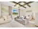 This is a bright bedroom with an intricate wood ceiling and a large window providing serene outdoor views at 13809 Abberwick Dr, Orlando, FL 32832