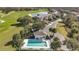 Aerial shot showing the community pool surrounded by mature trees and landscaping at 13809 Abberwick Dr, Orlando, FL 32832