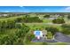 Aerial view featuring the community pool and surrounding lush landscape at 13809 Abberwick Dr, Orlando, FL 32832