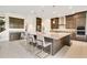 Spacious kitchen features a large island, granite countertops, and stainless steel appliances at 13809 Abberwick Dr, Orlando, FL 32832