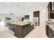 Kitchen with stainless steel appliances, granite countertops and a large island at 13809 Abberwick Dr, Orlando, FL 32832