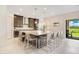 Open concept kitchen with a large island, pendant lighting, stainless steel appliances, and bar seating at 13809 Abberwick Dr, Orlando, FL 32832
