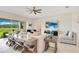 Well-lit living room with wide sliding doors, neutral decor, textured white brick wall, and comfortable seating at 13809 Abberwick Dr, Orlando, FL 32832